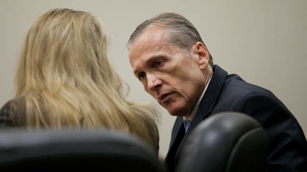 Martin MacNeill speaks to his attorney during his murder trial in Provo, Utah.