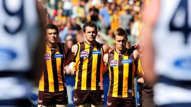 Sam Mitchell (right) side by side with Luke Hodge on grand final day 2008.