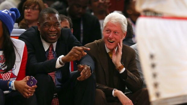 Friends in high places: NBA legend Dikembe Mutombo talks with former president Bill Clinton during the 2015 NBA All-Star Game at Madison Square Garden on February 15.