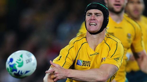 In line ... Berrick Barnes is in the running for the  five-eighth role when the Wallabies face Scotland on Tuesday.