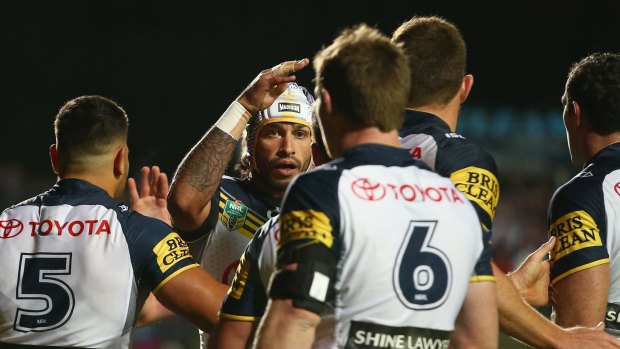 Riding high: Johnathan Thurston and the Cowboys celebrate during their win over Manly at Brookvale Oval on Monday.