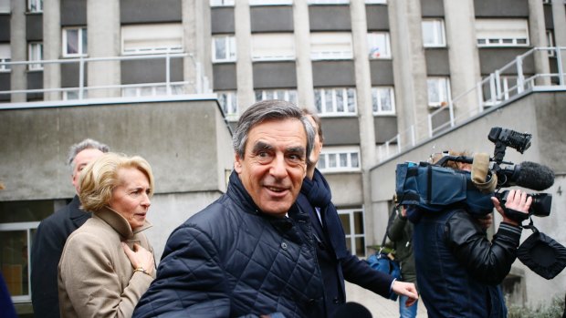 Conservative presidential candidate Francois Fillon leaves after delivering a speech in Paris on Wednesday.