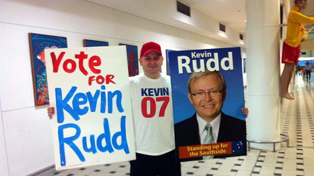 Supporter: ALP member Brad Newman waits for Kevin Rudd to arrive at Brisbane Airport.