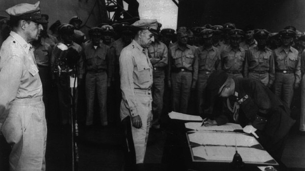 Japanese General Yoshijiro Umezo, Chief of the Imperial Staff, signs Japan's surrender documents on September 1, 1945 aboard the USS Missouri.