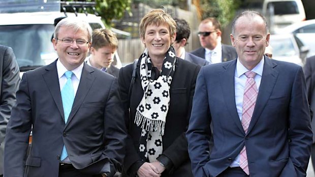 Axed ... Former Prime Minister Kevin Rudd, left, walks with Lindsay Tanner, far right, in August 2010.