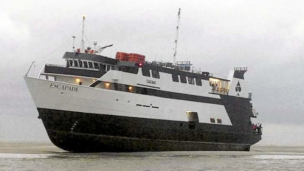 The Escapade, a 174-foot boat carrying 96 passengers and 27 crew members, is seen grounded off the Georgia coast.