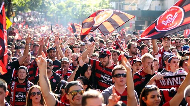 Red and black bloc: Wanderers' fans rule the streets on the way to the stadium.
