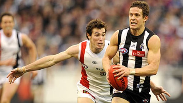 St Kilda's Lenny Hayes chases Luke Ball in July this year.