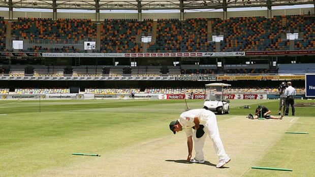 Ricky Ponting inspects the Gabba pitch in November 2006.