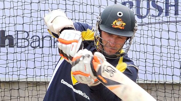Michael Hussey keeps his eyes on the ball during a nets session in Melbourne yesterday.