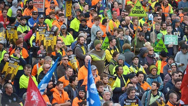 Union members rally in Melbourne against the Federal Government's budget.