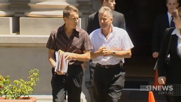 Peter and Ray Mickelberg exit court after another battle.