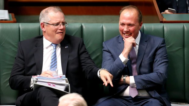 Treasurer Scott Morrison and Minister for Immigration and Border Protection Peter Dutton during question time at Parliament House. 
