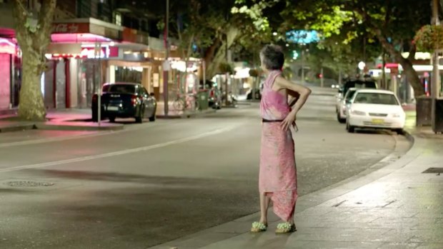 Lee Lin Chin looks back at a deserted Sydney street in a spoof attacking the lockout laws.