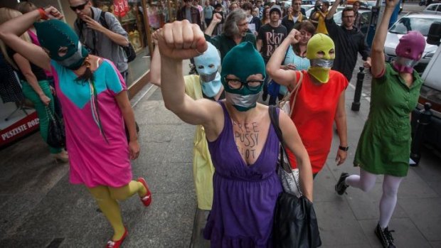 Silent protest:  Wearing Pussy Riot's trademark balaclavas, and with their mouths taped, supporters of the group demonstrate in front of the Russian Embassy in Warsaw, Poland, in 2012.
