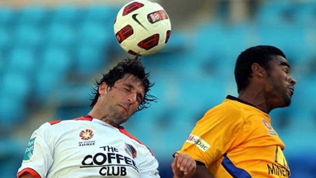 Brisbane Roar's Thomas Broich and Robson Gold Coast United compete for the ball when the sides met earlier this season.