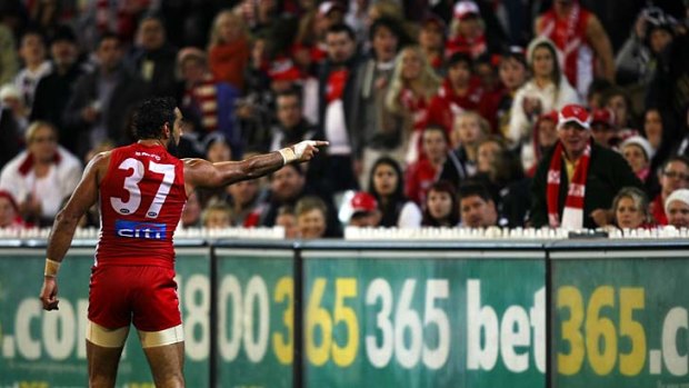 Shattered: Adam Goodes points to his abuser during Friday night's match against Collingwood.