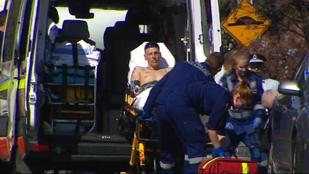 Robert Chorbadjian is taken away in an ambulance