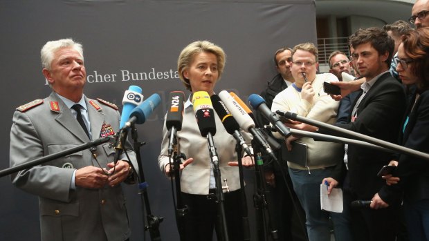 Volker Wieker, chief of staff of the German military, left, and Defence Minister Ursula von der Leyen, right, speak to the media during a special meeting of a German federal Parliament commission.