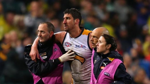 Disadvantage, Eagles: Dean Cox is helped off the ground on Friday night after being felled by Tyrone Vickery.