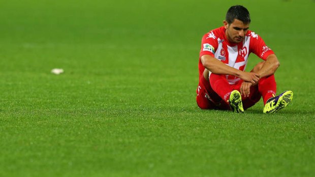 Aziz Behich of Melbourne Heart struggles to cope with another loss.