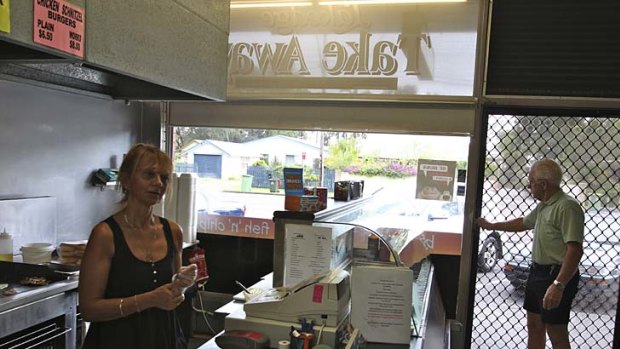 Flipping it over . . . Mary Caputo, in her Berkeley Vale take away shop, is yet to decide whom she will vote for in the election.
