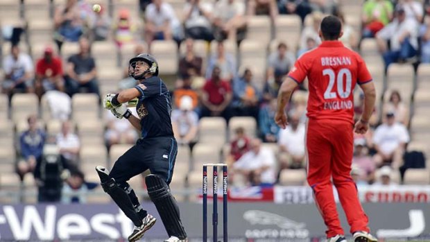Ugly, but it worked: New Zealand's Ross Taylor, left, tries to hit Tim Bresnan's slow, high delivery.