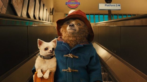 Bear in there: Paddington and a friend navigate the London Underground. 