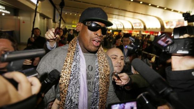 Former NBA basketball player Dennis Rodman speaks to the media after returning from his trip to North Korea at Beijing airport.