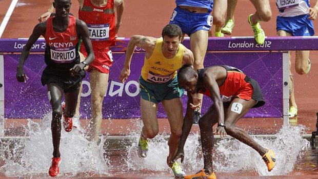 Australia's Youcef Abdi (middle) during his men's 3000m steeplechase heat.