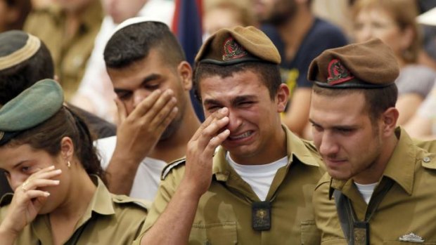 Israeli comrades mourn during the funeral of Sergeant Max Steinberg  in Jerusalem.