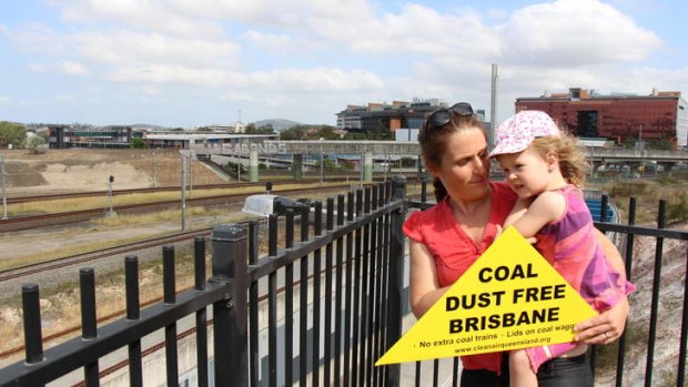 Marnie and Indigo Cotton protest the uncovered coal trains in Brisbane.