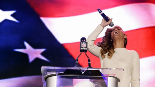 "Any questions?" ... Beyonce performs the national anthem during her Super Bowl press conference.