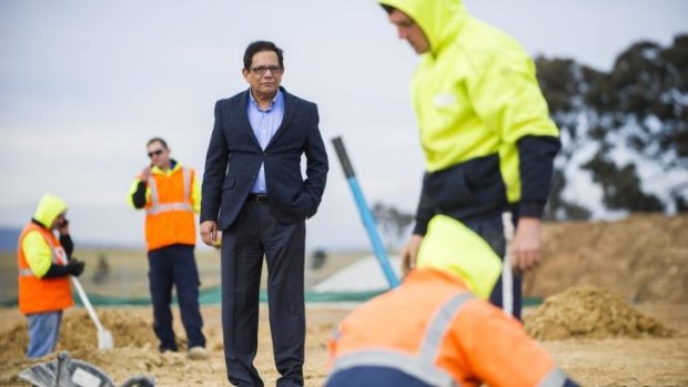 Vice president of the Canberra Muslim Community Tanveer Khan watches on as workers begin work on the footings of the Gungahlin Mosque in July.