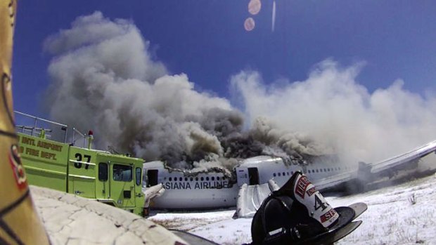 A camera mounted on a firefighter's helmet captures the moments after the plane crashed.
