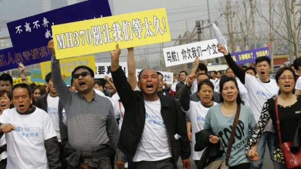 Outpouring of anger: relatives of missing MH370  passengers protest.