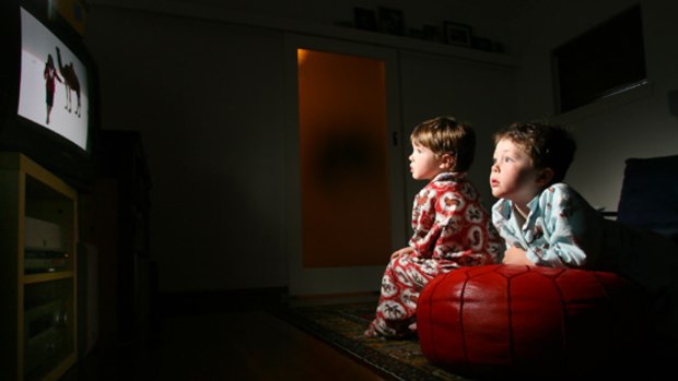 Kit and Tom watch TV at home in Moorabbin.