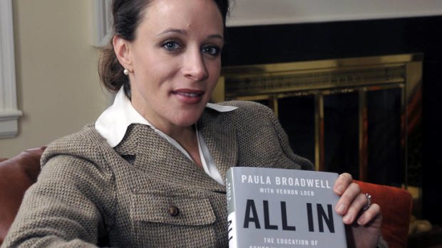 Biographer ... Paula Broadwell poses with her book about David Petraeus.