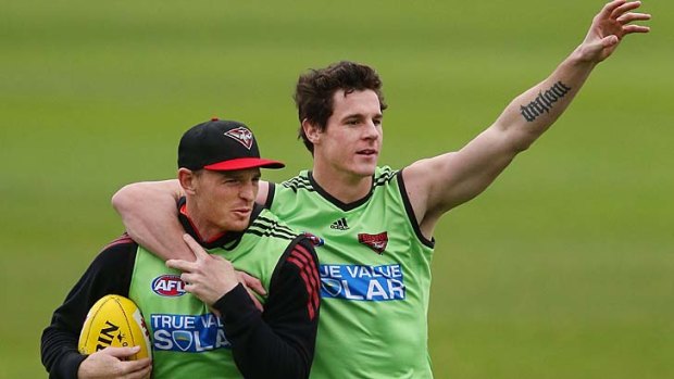Jake Carlisle and Brendon Goddard during a training session at Windy Hill on Friday.