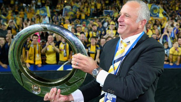 Fourth time lucky: Graham Arnold and the Mariners finally lifted the golden toilet seat when they ended the Wanderers' fairytale in the grand final.