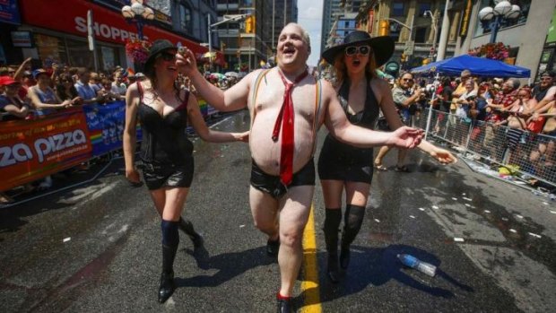 Dressed to mock: A man dressed as Rob Ford takes part in the WorldPride   parade in Toronto on Sunday.  