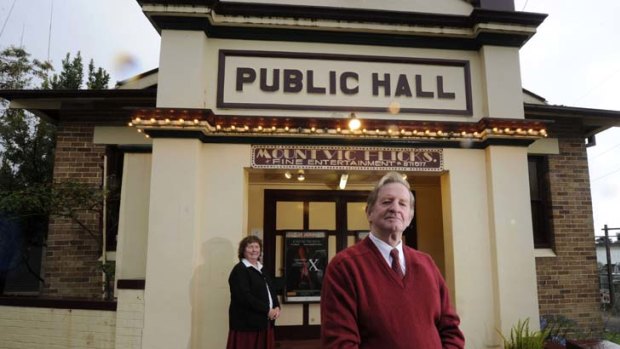 ''The film distributors are more interested in DVDs these days'' ... Ron and Diane Bayley outside their cinema, Mount Vic Flicks, which they have owned for 25 years.