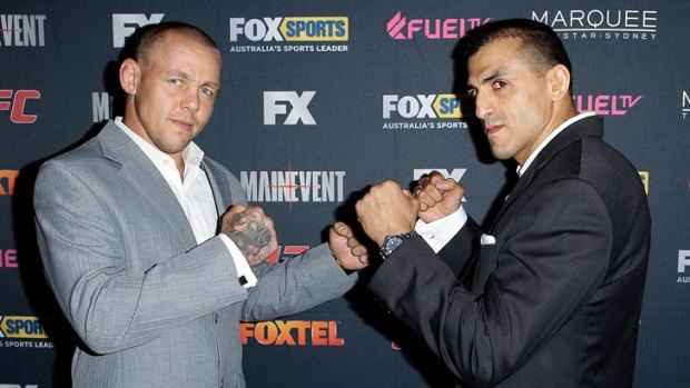 Australian coach George Sotiropoulos (right) faces off against Team UK coach Ross Pearson at the television launch of The Ultimate Fighter: The Smashes.