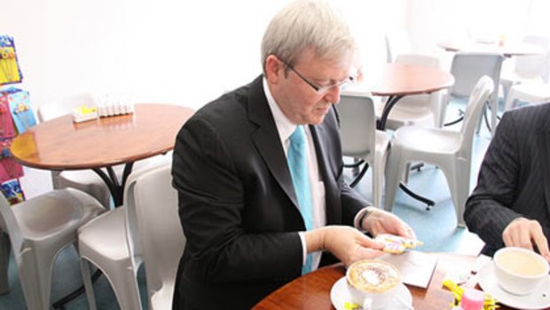 Kevin Rudd posts picture of himself eating a biscuit.