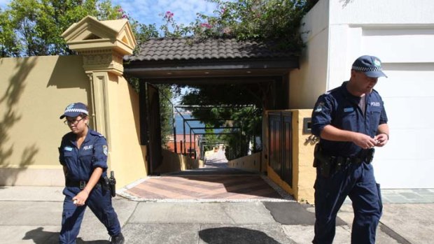 Nightmare on Wolseley Road ... police outside Salvatore Paino's waterfront mansion at Point Piper yesterday.