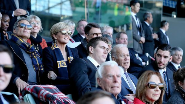 US Vice-President Joe Biden attends an AFL match between West Coast and Carlton at the MCG. With him were Maxson Cox and Foreign Minister Julie Bishop.