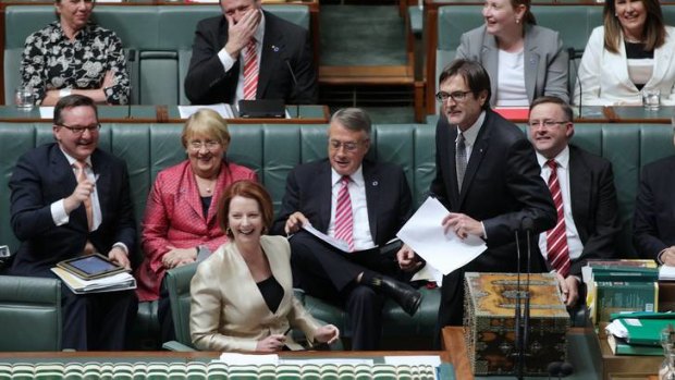 Prime Minister Julia Gillard reacts to Climate Change Minister Greg Combet's comments during Question Time.