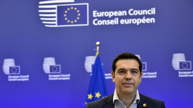 Defiant ... Greek Prime Minister Alexis Tsipras answers journalists' questions after an EU summit at the EU headquarters in Brussels.