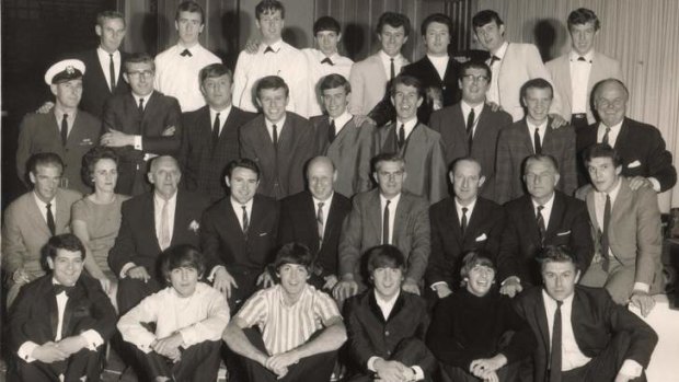 Flash back: (back row, far right): Noel Tresider; Johnny Devlin (third from right); Johnny Chester (fourth from right; members of the group The Phantoms (in white suits). Seated: Kenn Brodziak (centre); Dick Lean (fourth from right). Sitting on floor: (from left to right): Alan Field; George Harrison; Paul McCartney; John Lennon; Ringo Starr; Derek Taylor.