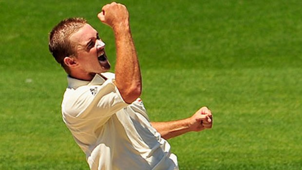 Nathan Hauritz punches the air after his five-wicket haul.